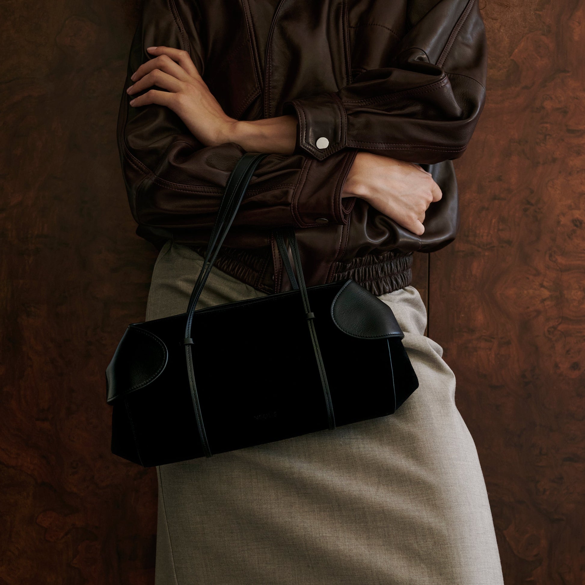 berenices-east-west-suede-leather-shoulder-bag-black